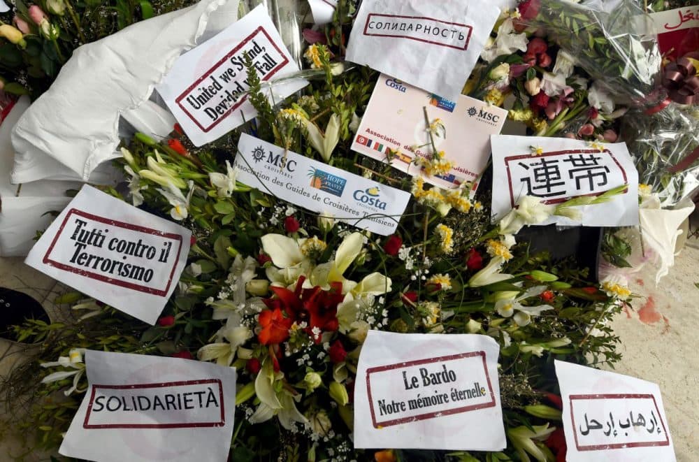 Flowers and messages of condolences are laid outside Tunisia's Bardo National Museum on March 24, 2015 in Tunis. (Fethi Belaid/AFP/Getty Images)