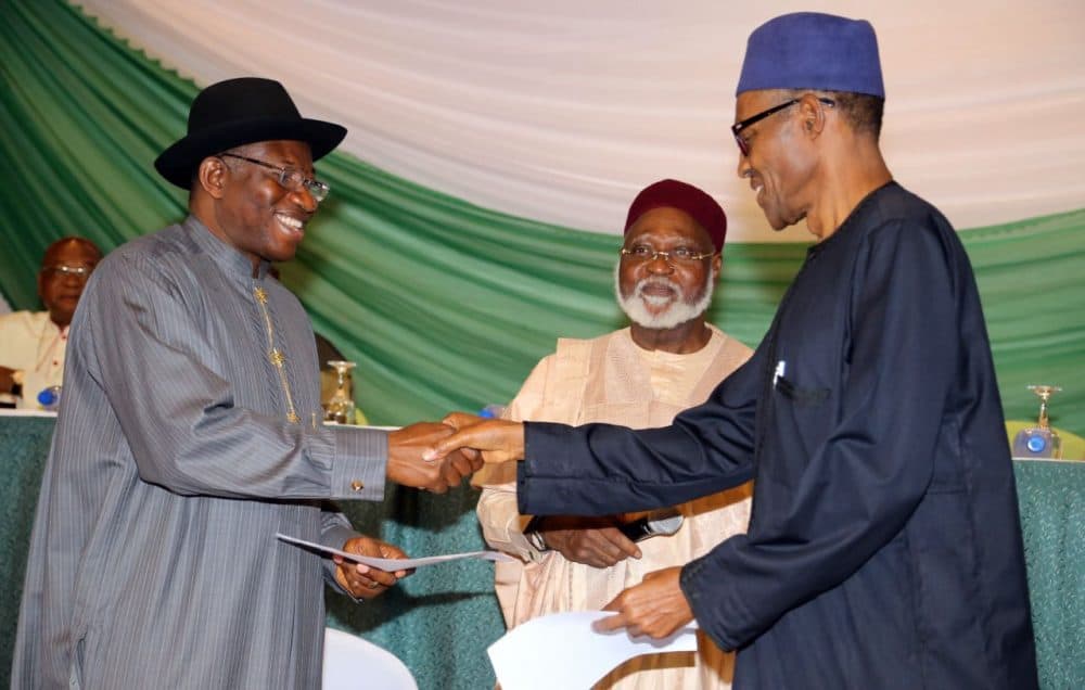 Nigerian President Goodluck Jonathan (left), and APC main opposition party's presidential candidate Mohammadu Buhari shake hands under the eyes of Chairman of the Abuja Peace Accord former Head of State General Abdulsalami Abubakar (center), after signing the renewal of the pledges for peaceful elections on March 26, 2015 in Abuja. Security is a major concern at Saturday's vote both from Boko Haram violence against voters and polling stations to clashes between rival supporters. In 2011, around 1,000 people were killed in violence after Jonathan beat Buhari to the presidency. (Philip Ojisua/AFP/Getty Images)
