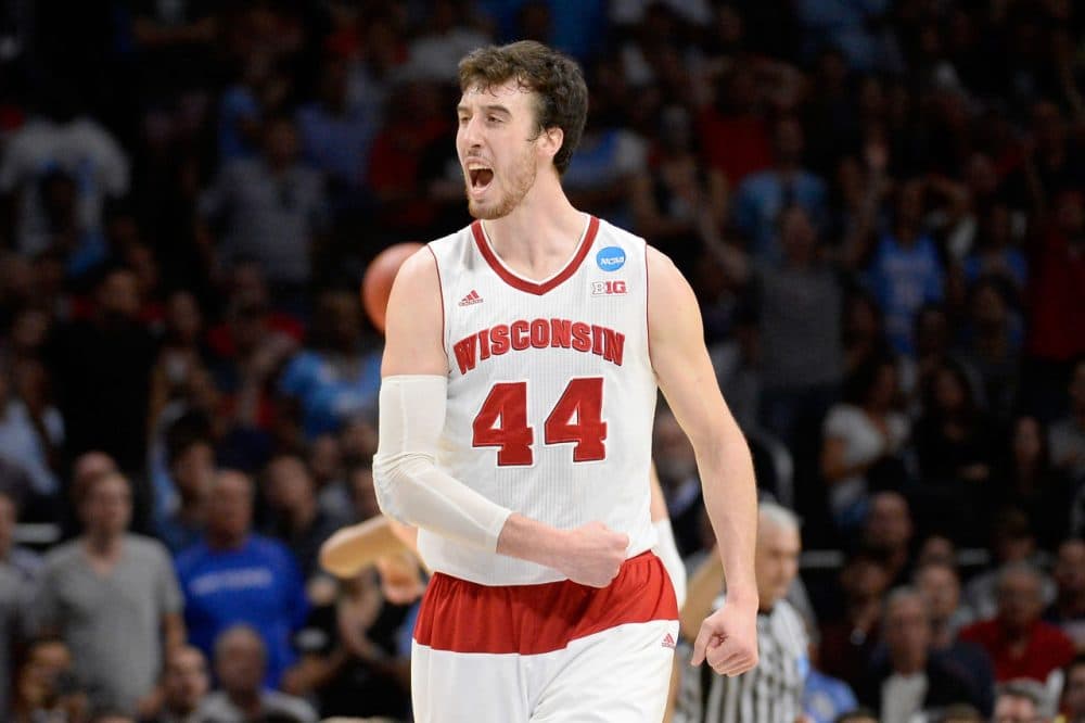 Wisconsin's senior center Frank Kaminsky had a lot to celebrate after his team defeated UNC to advance to the Elite Eight. But more fans watched the badger's football team in the Outback Bowl. (Harry How/Getty Images)