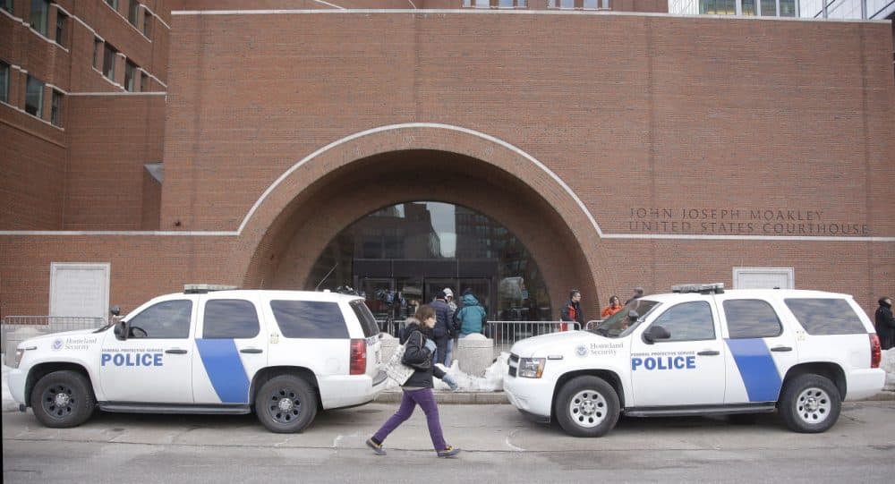 Homeland Security vehicles were staged outside the main doors of the federal courthouse in Boston on Monday. (Stephan Savoia/AP)