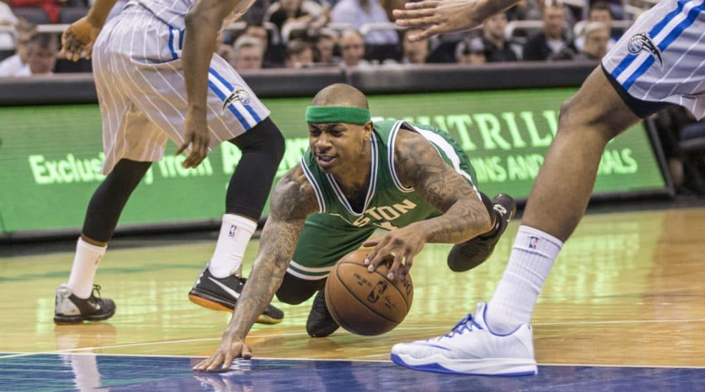 Celtics guard Isaiah Thomas (4) looses his balance and goes down during the second half of an NBA basketball game in Orlando, Fla., Sunday, March 8, 2015. (AP Photo/Willie J. Allen Jr.)