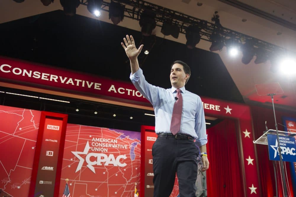 Wisconsin Gov. Scott Walker waved as he walked onstage to address the Conservative Political Action Conference last week. (Cliff Owen/AP)