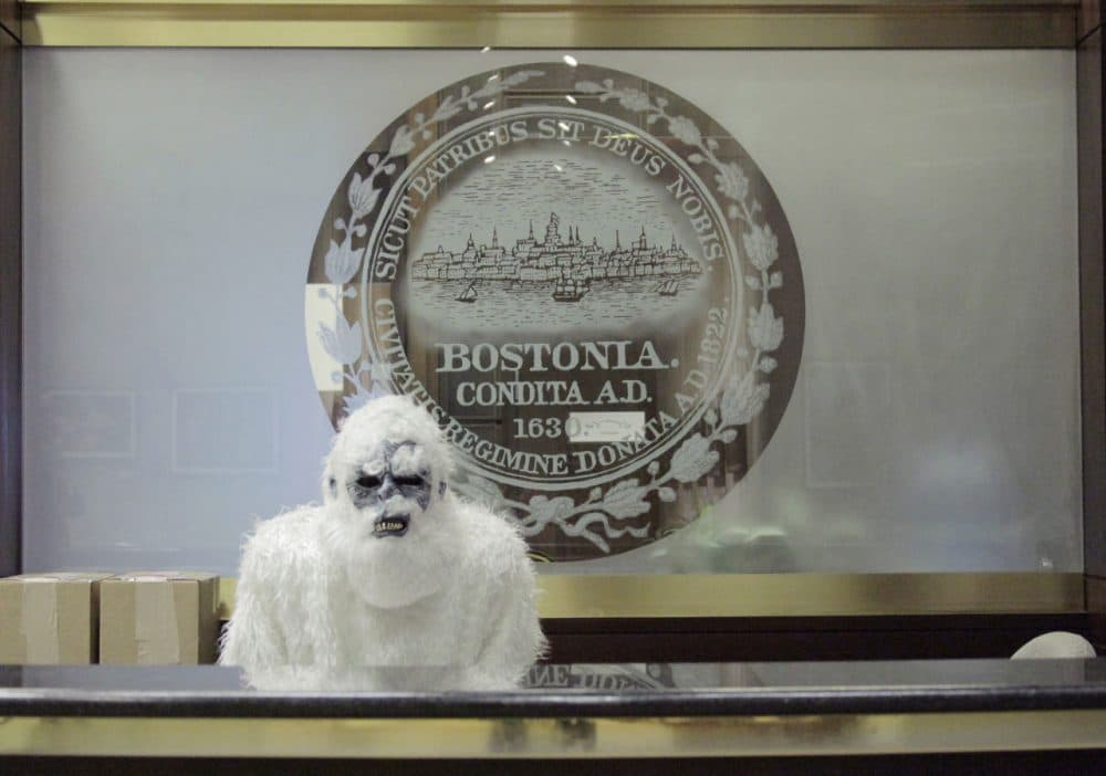 In this March 6, 2015 photo, an anonymous creature known as The Boston Yeti poses in front of the Boston logo at City Hall in Boston.  (Eric Gulliver/AP)