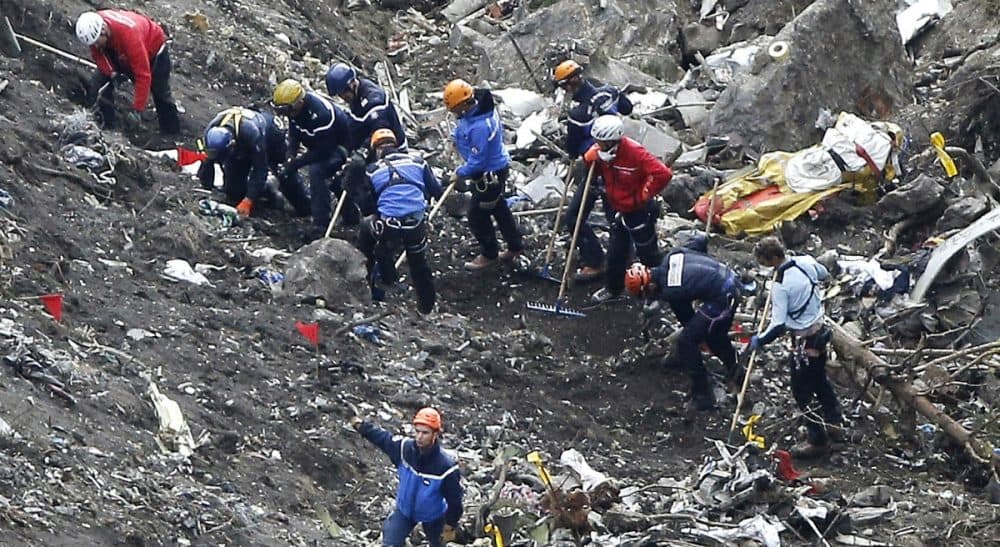 Tom LeCompte: &quot;Who’s going to land the plane if things go wrong? We already ride on trains without engineers and are preparing for driverless cars. Why not pilotless airliners?&quot; Pictured: Rescue workers work on debris of the Germanwings jet at the crash site near Seyne-les-Alpes, France, Thursday, March 26, 2015. The co-pilot of the Germanwings jet barricaded himself in the cockpit and “intentionally” rammed the plane full speed into the French Alps, ignoring the captain’s frantic pounding on the cockpit door and the screams of terror from passengers, a prosecutor said Thursday. In a split second, he killed all 150 people aboard the plane. (Laurent Cipriani/AP)