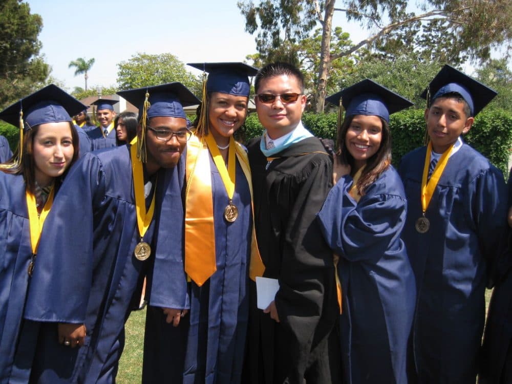 Tommy Chang will begin as superintendent on July 1. Here he is with students at a graduation ceremony at Ánimo Venice Charter High School, part of the Los Angeles Unified School District. (Courtesy of LAUSD)