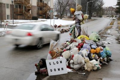A car passes a memorial for Michael Brown, who was shot and killed by Ferguson, Mo., Police Officer Darren Wilson last summer, Tuesday, March 3, 2015, in Ferguson. A Justice Department investigation found sweeping patterns of racial bias within the Ferguson police department, with officers routinely discriminating against blacks by using excessive force, issuing petty citations and making baseless traffic stops, according to law enforcement officials familiar with the report.  (AP)