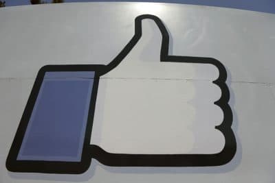This June 11, 2014 file photo shows Facebook's &quot;like&quot; symbol at the entrance to the company's campus in Menlo Park, Calif. Facebook users in the U.S. will soon be able to send their friends money using the social network’s Messenger app, the company announced Tuesday, March 17, 2015. (AP)