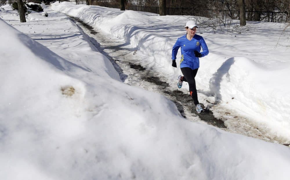 Runner Becca Pizzi, 34, trains along Heartbreak Hill in Newton, Mass., Friday, Feb. 27. (Elise Amendola/AP)