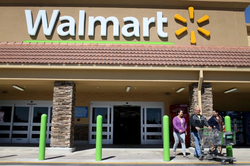 Walmart customers exit from the store on February 19, 2015 in Miami, Florida. (Joe Raedle/Getty Images)