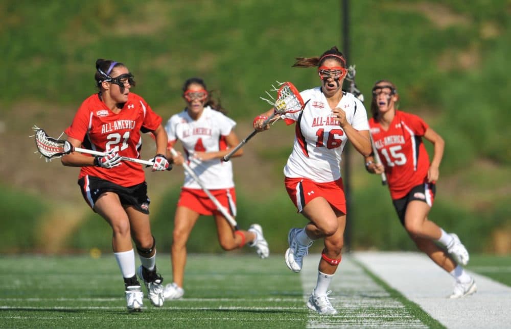 In women's lacrosse, athletes are not required to wear helmets. Florida has become the first state requiring female lax players wear protective head gear.  (Larry French/Getty Images for Under Armour)