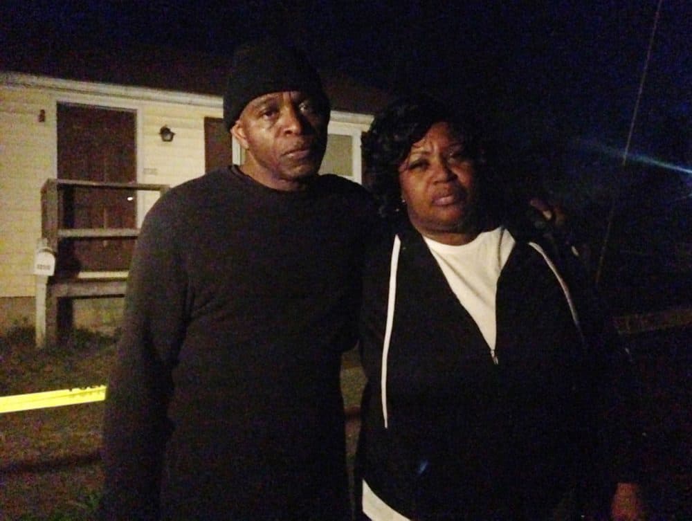 Lloyd Edwards, left, and Bonnie Edwards, the stepfather and mother of Rodney Todd stand outside the home where Todd and his seven children found dead Monday, April 6, 2015, in Princess Anne, Md. Police found the bodies at the home after being contacted by a concerned co-worker of the father, who had not been seen for days, Princess Anne police said in a news release. (Juliet Linderman/AP)