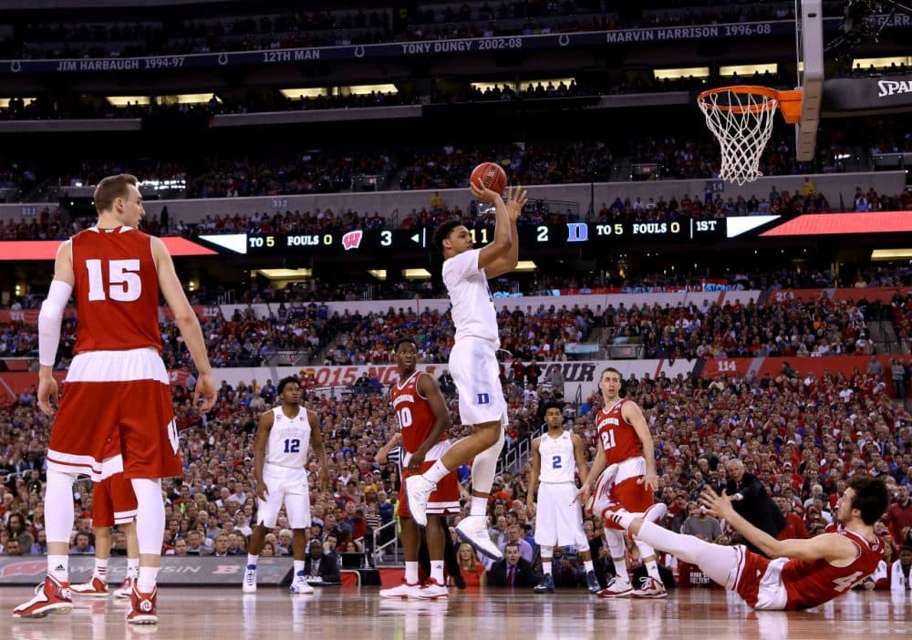 Jahlil Okafor #15 of the Duke Blue Devils shoots against Frank Kaminsky #44 of the Wisconsin Badgers in the first half during the NCAA Men's Final Four National Championship at Lucas Oil Stadium on April 6, 2015 in Indianapolis, Indiana. (Streeter Lecka/Getty Images)