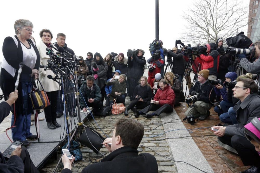 Boston Marathon bombing survivor Karen Brassard, left, speaks outside federal court alongside Laurie Scher, second from left, and Mike Ward, third from left, Wednesday, April 8, 2015, in Boston where Dzhokhar Tsarnaev was convicted on multiple charges in the 2013 Boston Marathon bombing. Three people were killed and more than 260 were injured when twin pressure-cooker bombs exploded near the finish line. (Steven Senne/AP)
