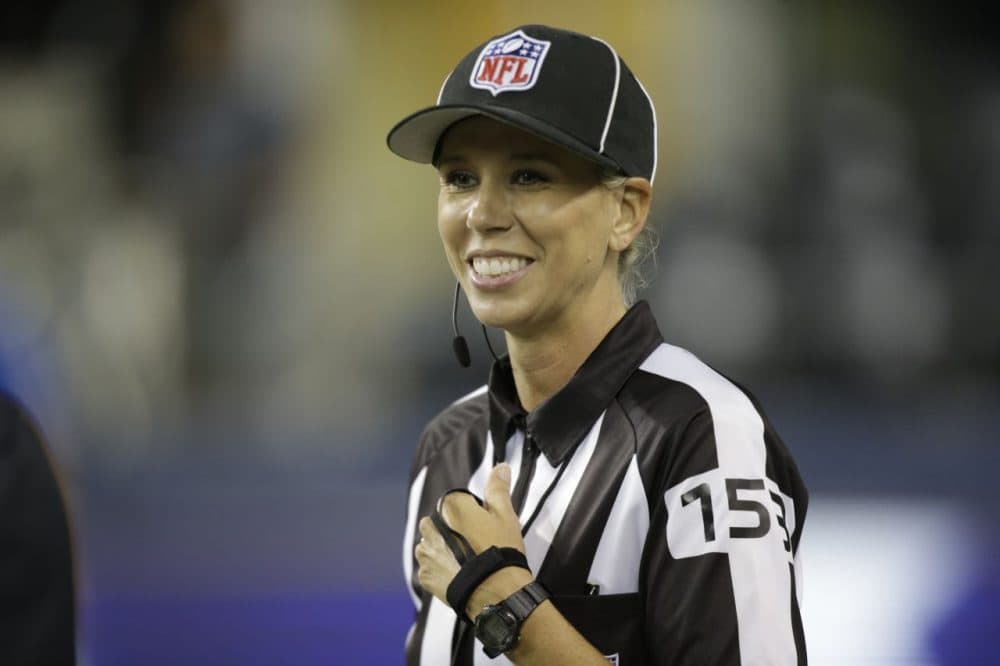 In this Aug. 15, 2014, file photo, developmental line judge Sarah Thomas smiles in the second half of a preseason NFL football game between the Seattle Seahawks and the San Diego Chargers in Seattle. The NFL has its first full-time female game official. Sarah Thomas, who has worked exhibition games, will be a line judge for the 2015 season, the league announced Wednesday, April 8, 2015. (Stephen Brashear/AP)