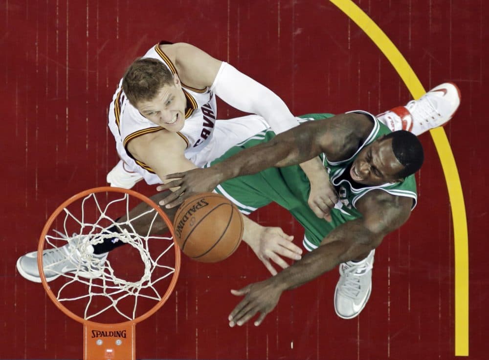 Boston Celtics' Brandon Bass, right, shoots on Cleveland Cavaliers' Timofey Mozgov in the first half of a first round NBA playoff game April 19, 2015, in Cleveland. (Tony Dejak/AP)