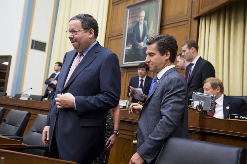 David L. Cohen, Executive Vice President of Comcast, and Robert D. Marcus, Chairman and CEO of Time Warner Cable, prepare to take their seats prior to the start of a House Judiciary Committee hearing on the proposed merger of Time Warner Cable and Comcast, on Capitol Hill, May 8, 2014 in Washington, D.C. The proposed merger would combine the two largest U.S. cable companies and give Comcast about 30 million subscribers in the United States. (Drew Angerer/Getty Images)