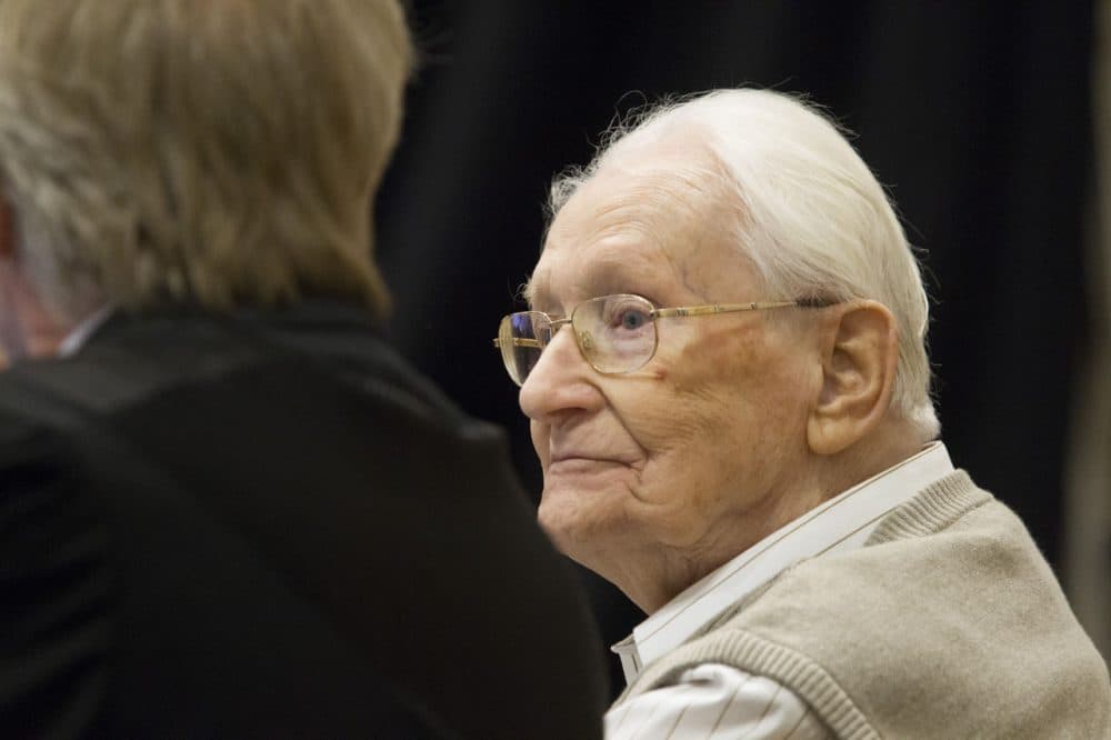 Oskar Groening, 93, arrives for the first day of his trial to face charges of being accomplice to the murder of 300,000 people at the Auschwitz concentration camp, April 21, 2015, in Lueneburg, Germany. Groening was an accountant with the Waffen SS and has been open about his role, claiming in interviews with media that he accepts his moral responsibility. Groening has also written an account of his experience, in what he claims is an effort to counter Holocaust revisionists. State prosecutors accuse Groening of accomplice in the murder of 300,000 Hungarian Jews who arrived at Auschwitz in 1944. (Andreas Tamme/Getty Images)