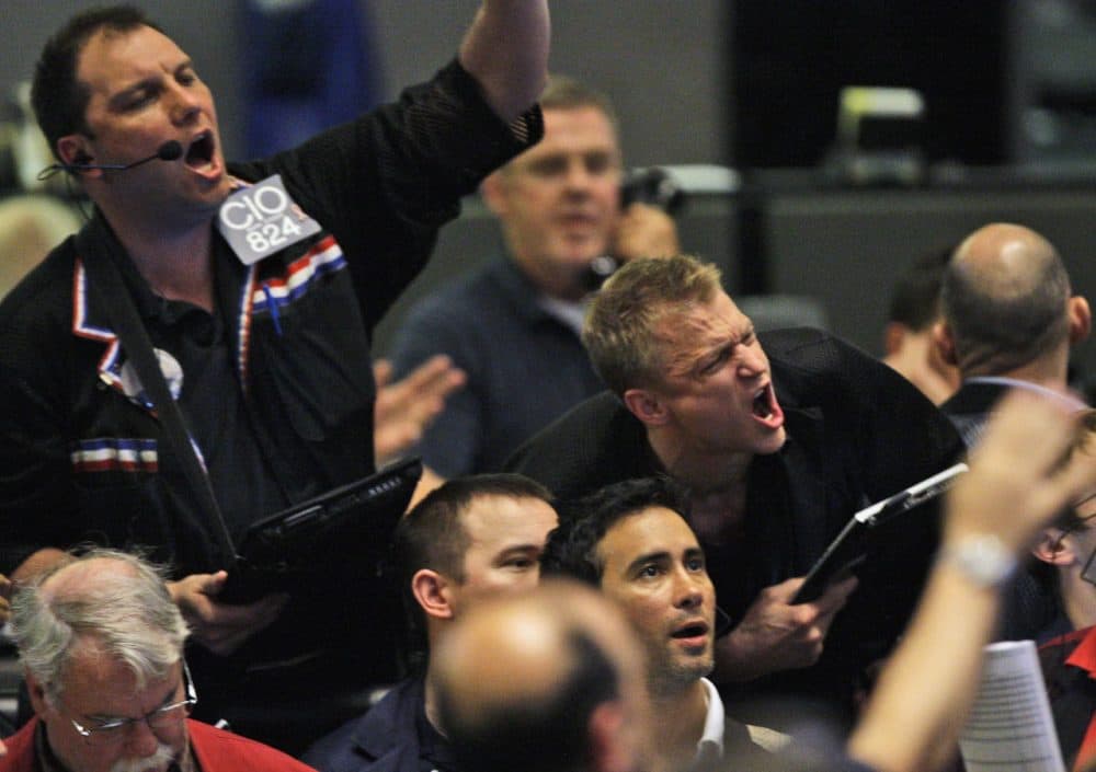Traders shout orders in the S&amp;P 500 futures pit at the CME Group in Chicago near the close of trading, Thursday, May 6, 2010. The stock market had one of its most turbulent days ever with the Dow Jones industrials plunging nearly 1,000 points in half an hour before recovering two-thirds of its losses. (Kiichiro Sato/AP)
