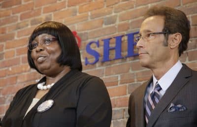 Ursula Ward, left, mother of Aaron Hernandez murder victim Odin Lloyd, speaks about her son while her attorney, Douglas Sheff, looks on during a news conference about Ward's civil case against Hernandez, Wednesday in Boston. (Stephan Savoia/AP)