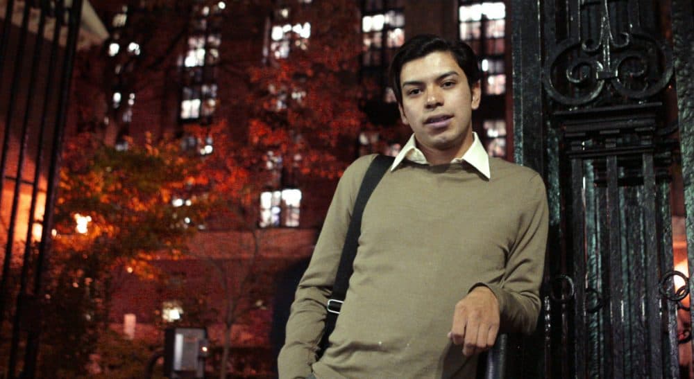 Mario Rodas of Chelsea, Mass., poses at one of the gates at Harvard University in Cambridge, Mass. on Nov. 2, 2009. As an undocumented Guatemalan-born immigrant, Rodas would have had to pay out-of-state tuition fees to go to a public college in Massachusetts. Rodas has since been granted asylum in the U.S. and studies at the Harvard University Extension School which has one tuition rate for all students. (Charles Krupa/AP)