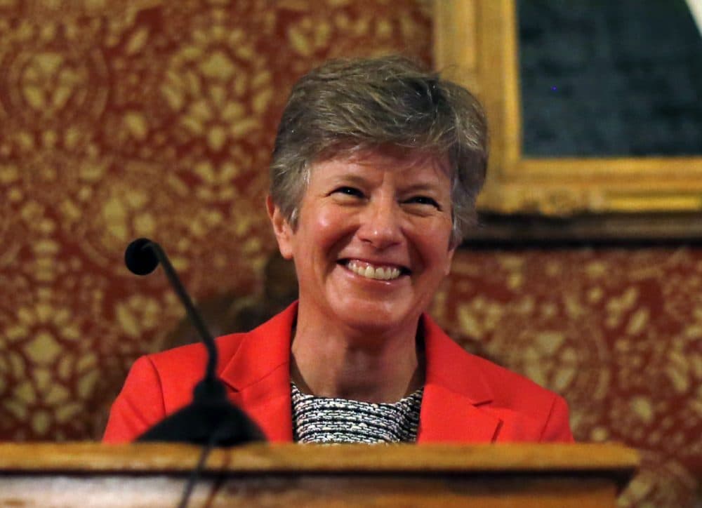 In this 2014 file photo, attorney Mary Bonauto smiles at Cambridge City Hall to mark the 10th anniversary of the first same-sex weddings in Massachusetts. (Elise Amendola/AP)