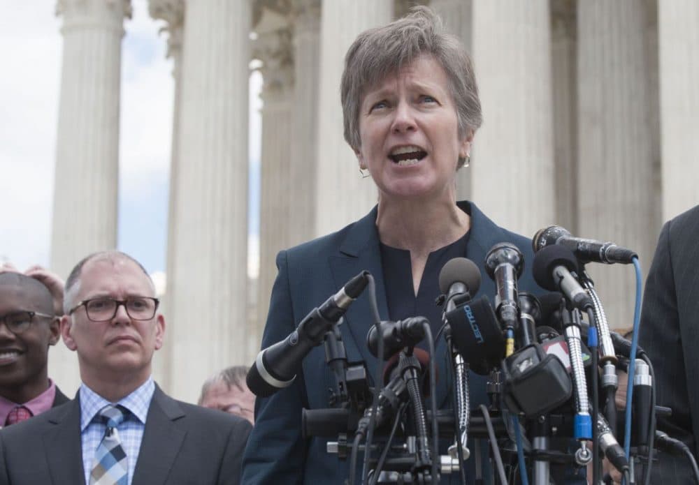 Primary counsel Mary Bonauto speaks to the media with lead plaintiff Jim Obergefell following oral arguments on Tuesday, April 28, 2015 in Washington. (Kevin Wolf/AP for Human Rights Campaign)