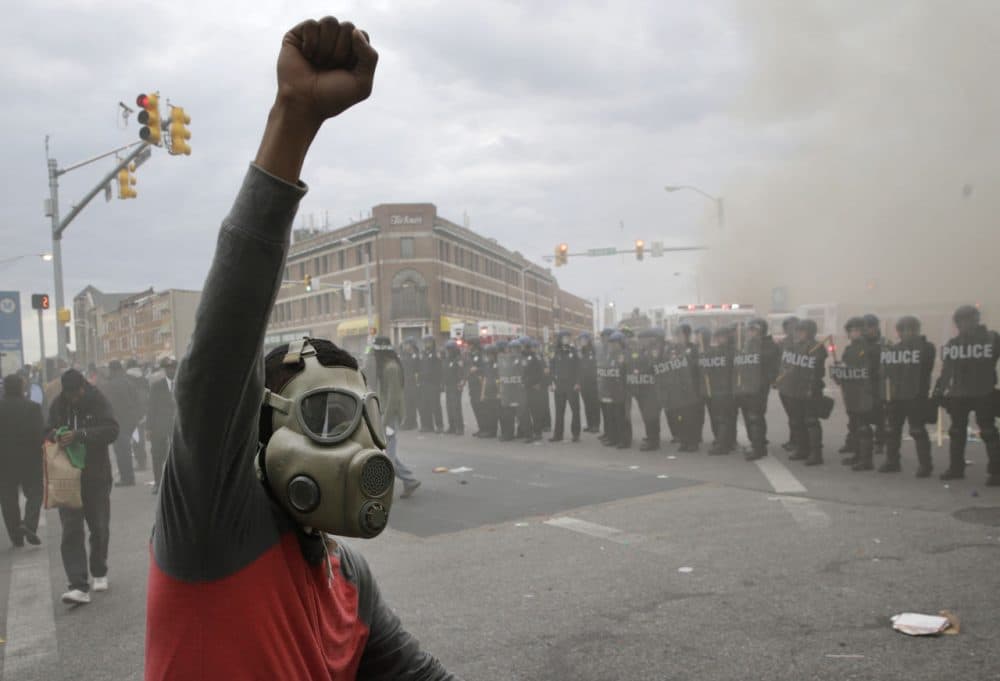 The Harvard poll findings come as anger over the death of Freddie Gray, a 25-year-old Baltimore resident, turned violent this week. (Patrick Semansky/AP)