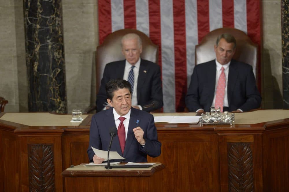 Japanese Prime Minister Shinzo Abe addresses a joint session of Congress at the U.S. Capitol in Washington, D.C., on April 29, 2015, as U.S. Vice President Joe Biden (left) and House Speaker John Boehner listen. (Saul Loeb/AFP/Getty Images)