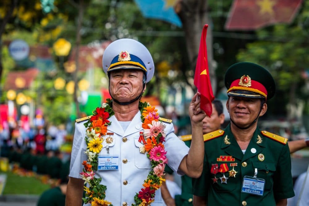 Men in military leadership pose for a portrait during the Reunification Day parade Thursday in Ho Chi Minh City. (Quinn Ryan Mattingly for WBUR)