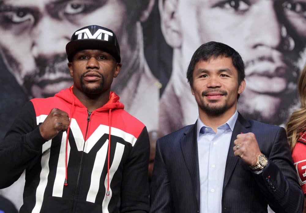 WBC/WBA welterweight champion Floyd Mayweather Jr. (left) and WBO welterweight champion Manny Pacquiao pose during a news conference at the KA Theatre at MGM Grand Hotel &amp; Casino on April 29, 2015 in Las Vegas, Nevada. The two will face each other in a unification bout on May 2, 2015 in Las Vegas. (John Gurzinski/AFP/Getty Images)