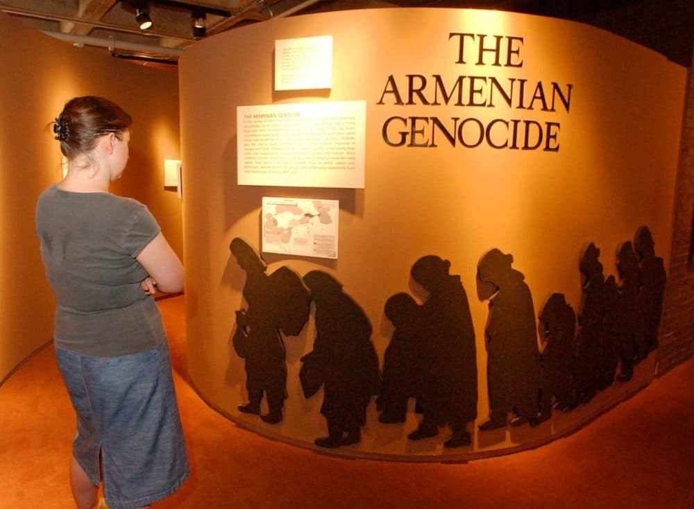 Susanne Wedlich of Newton, Mass., looks at an exhibit about the Armenian genocide at the Armenian Library and Museum of America in Watertown, Mass. in August of 2005. (Lisa Poole/AP)