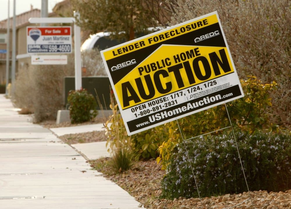 Signs are seen outside a foreclosed home and a house for sale February 24, 2009 in North Las Vegas, Nevada. (Ethan Miller/Getty Images)