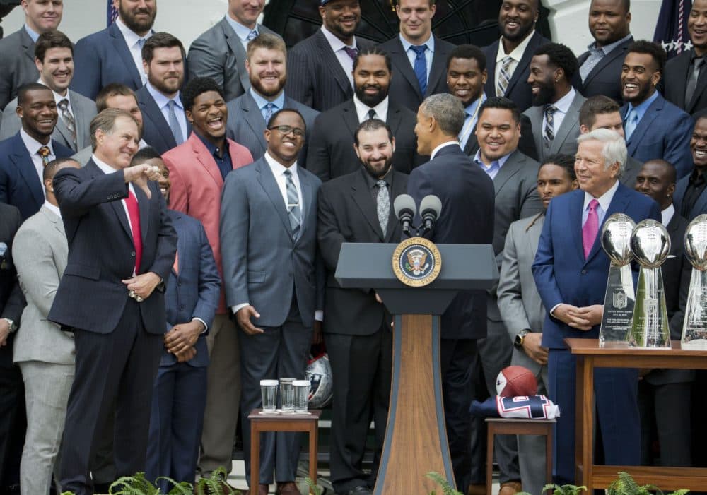 New England Patriots coach Bill Belichick, left, gives a thumbs down to President Obama's &quot;Deflategate&quot; joke during a ceremony Thursday honoring the team for their Super Bowl victory. (Pablo Martinez Monsivais/AP)