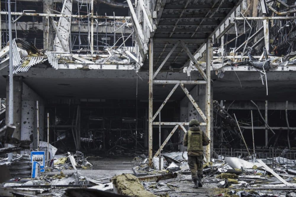A Russia-backed rebel enters  the destroyed building of Donetsk Airport just  outside Donetsk, eastern Ukraine, Thursday, April 2, 2015. OSCE monitors accompanied by pro-Russian rebels visited the ruins of Donetsk Airport and nearby areas to monitor the situation on the ground and discuss the observance of Februarys cease-fire. (Mstyslav Chernov/AP)