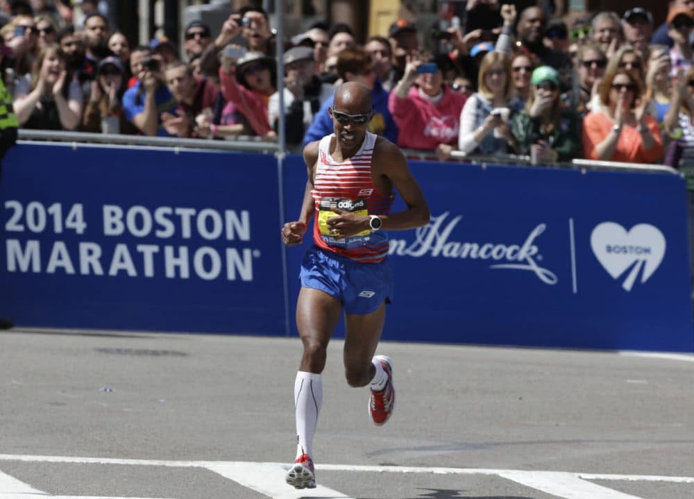 Meb Keflezighi turns onto the last stretch before winning the 118th Boston Marathon, Monday, April 21, 2014. (AP Photo/Steven Senne)