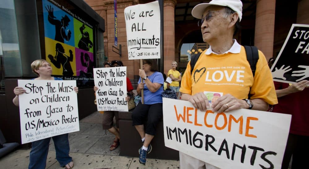 John Tirman: &quot;We should begin to understand who our immigrant population is -- where they came from and why, their aspirations, their contributions to American society -- in order to help this new (and great) migration succeed for all.&quot;
Pictured: July 18, 2014, protestors in Philadelphia demonstrate near the Consulate of Mexico in support of immigrants entering the United States via Mexico. (Matt Rourke/AP)