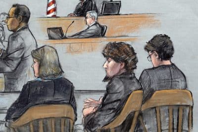 In this courtroom sketch, Assistant U.S. Attorney Aloke Chakravarty, left, is depicted addressing the jury as defendant Dzhokhar Tsarnaev, second from right, sits between his defense attorneys during closing arguments in Tsarnaev's federal death penalty trial Monday, April 6, 2015, in Boston.  Tsarnaev was found guilty by a jury on April 8, 2015. (AP)