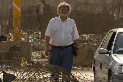 John Burns on location in Baghdad, Iraq in 2003. (Ashley Gilbertson / New York Times)