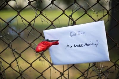 A card with a message addressed to the Scott family is affixed to a fence at the scene where Walter Scott was killed by a North Charleston police officer Saturday after a traffic stop in North Charleston, S.C., Thursday, April 9, 2015. (AP)