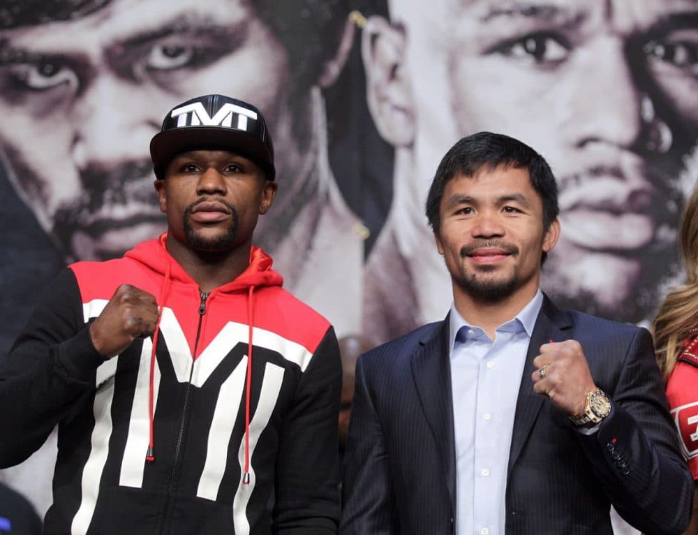 This weekend's fight between Floyd Mayweather (left) and Manny Pacquiao (right) is expected to bring in hundreds of millions of dollars to Las Vegas casinos, but Joe Drape says it alone won't save boxing.(JOHN GURZINSKI/AFP/Getty Images)