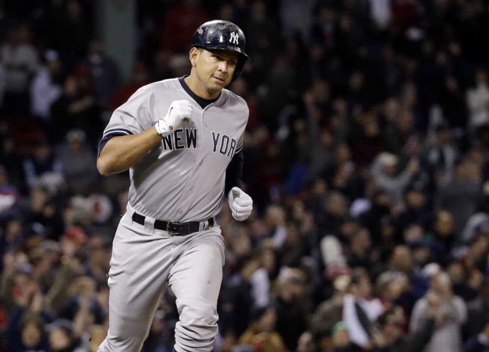 Alex Rodriguez runs to first after hitting a solo homer.  Rodriguez has now tied slugger Willie Mays with 660 career home runs. (AP Photo/Elise Amendola) 