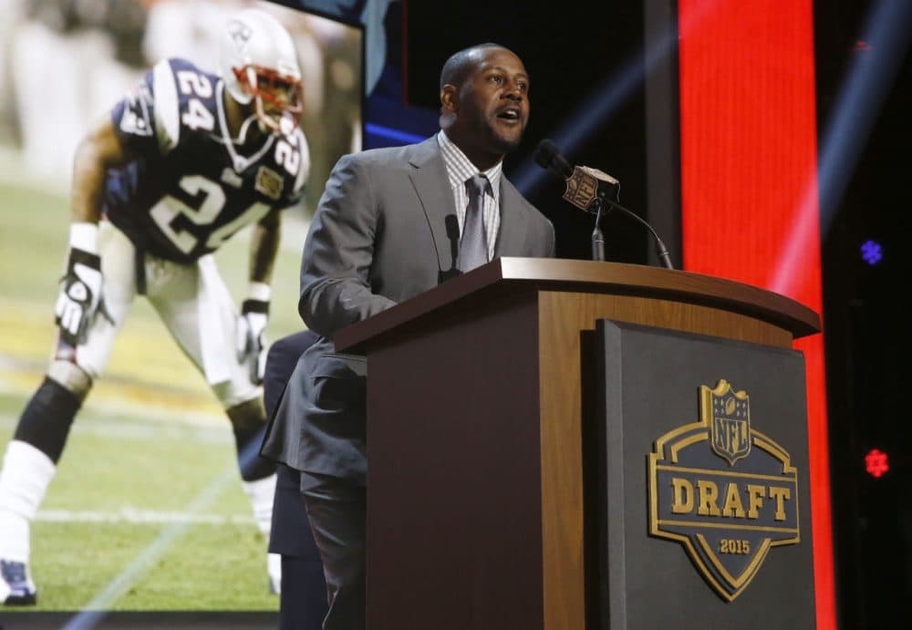 Former New England Patriots cornerback Ty Law announces that the Patriots selects Stanford Jordan Richards as the 64th pick in the second round of the 2015 NFL Football Draft,  Friday, May 1, 2015, in Chicago. (AP Photo/Charles Rex Arbogast)