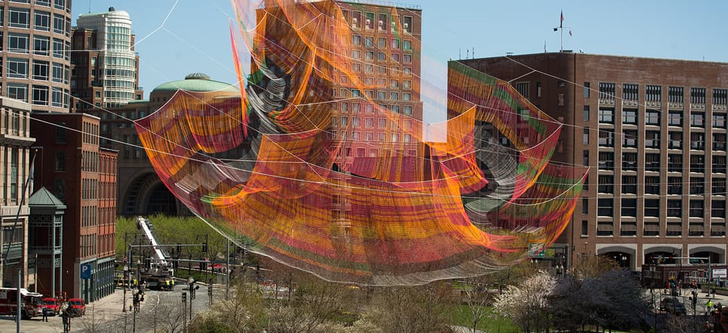 Janet Echelman's aerial sculpture takes shape over the Rose Kennedy Greenway in Boston. (Robin Lubbock/WBUR)