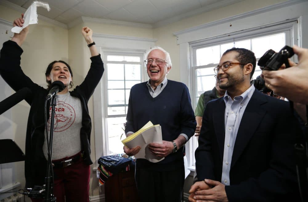Presidential hopeful U.S. Sen. Bernie Sanders reacts as supporters cheer him on at a house party in Manchester, New Hampshire, last weekend. (Cheryl Senter/AP)