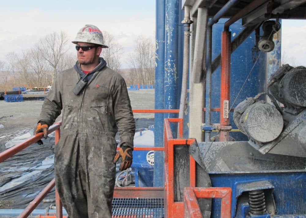 A worker stands by a natural gas well in Susquehanna County, Pa. (Susan Phillips/StateImpact Pennsylvania)