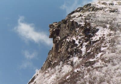Old Man of the Mountain on April 26, 2003, seven days before the collapse. A late spring snow fell the night before. (Wikimedia Commons)