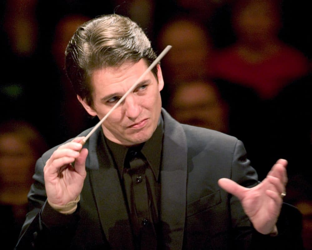 Celebrating his 10th year as conductor of the Boston Pops, Keith Lockhart conducts the orchestra on opening night in Boston, Tuesday, May 11, 2004.  (Robert E. Klein/AP)