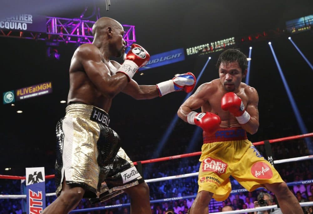 Saturday's bout between Floyd Mayweather (lefty) and Manny Pacquiao (right) was labeled the &quot;fight of the century.&quot; It was not. (John Gurzinski/AFP/Getty Images)