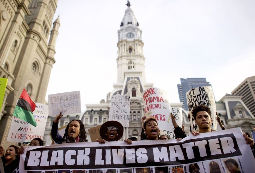 Protesters march past City Hall during a demonstration over the death of Freddy Gray outside City Hall on April 30, 2015 in Philadelphia, Pennsylvania. Freddie Gray, 25, was arrested for possessing a switch blade knife April 12 outside the Gilmor Houses housing project on Baltimore's west side. According to his attorney, Gray died a week later in the hospital from a severe spinal cord injury he received while in police custody. (Mark Makela/Getty Images)