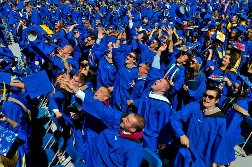In this May 31, 2014 file photo, graduates throw their caps in the air in triumph at the University of Delaware's commencement ceremony in Newark, Del.  It turns out their majors might matter more than they think in their future earnings. (Emily Varisco/AP)